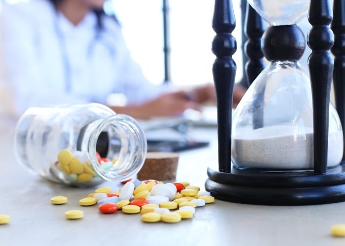 doctor-office-with-pills-hourglass_144627-43918